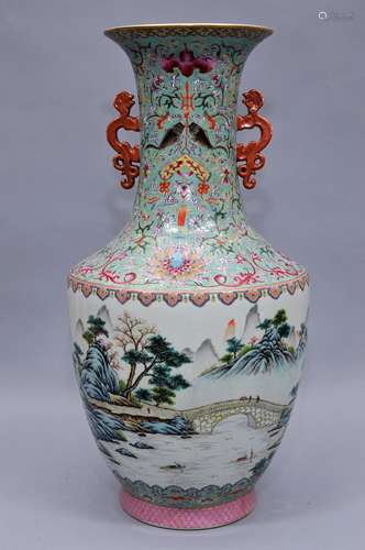 Porcelain vase. China. Late 19th century to early 20th century. Animal form handles in iron red and gilt. Famille Rose landscape. Borders of stylized lotus scrolls and auspicious emblems on a pale turquoise ground. Ch'ia Ching mark on the base. 24