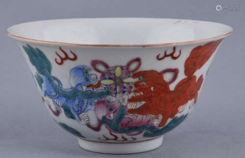 Porcelain bowl. China. 19th century. Famille Rose decoration of Foo Dogs playing. Ch'ien Lung mark on the base.  5-1/2