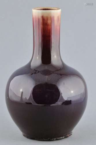 Porcelain vase. China. Early 20th century. Bottle form. Flambé glaze of purple and red. 9-3/4