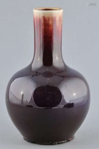 Porcelain vase. China. Early 20th century. Bottle form. Flambé glaze of purple and red. 9-3/4