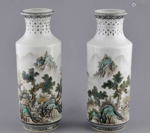 Pair of porcelain vases. China. Republican period. Cylindrical body with a slightly flared neck. Decoration of a mountain landscape with inscription. Sepia borders. Signed on the base. 10