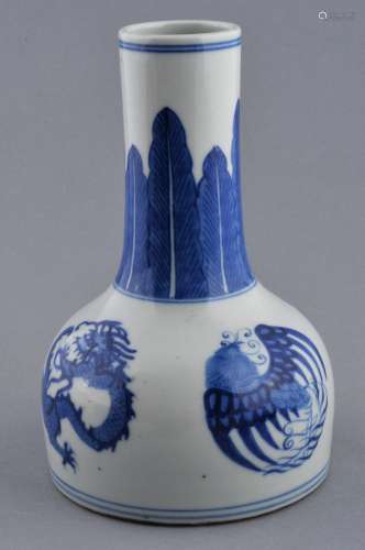 Porcelain vase. China. 20th century. Mallet shaped. Underglaze blue decoration of acanthus leaves and roundels of phoenixes and dragons. 7-1/4