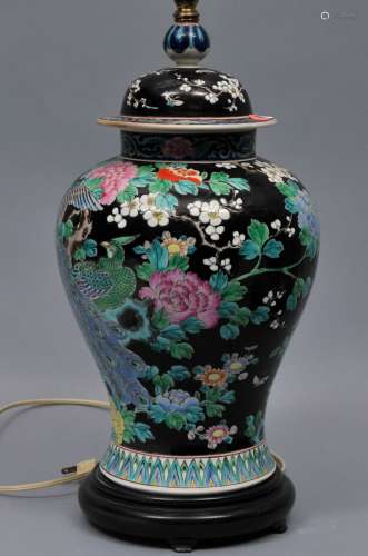 Porcelain covered jar. Japan. Early 20th century. Famille Noir decoration of flowers. 17
