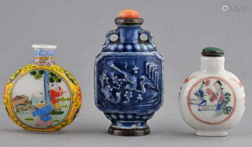 Lot of three Snuff Bottles. China. Two porcelain 19th century bottles. One with a blue glaze and moulded decoration, the other with Famille Rose enamels together with a 20th century Ku Yaeh Hsuan style enameled glass bottle. Largest- 3-3/4