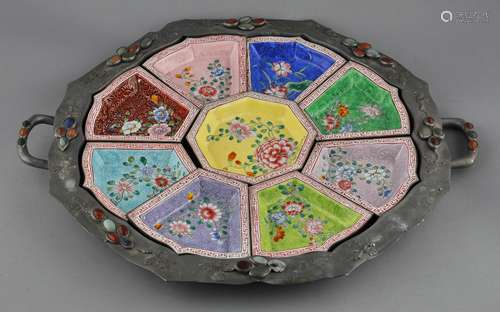 Sweetmeat dish. China. Early 20th century. Pewter inset with cabochons of lapis lazuli, malachite, jade and carnelian. Inserts of Peking enamel decorated with flowers. 20-1/2