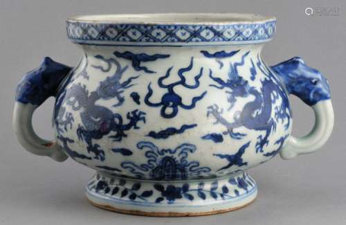 Porcelain censer. China. Chia Ching mark (1522-1567) and probably of the period. Animal form handles. Underglaze blue decoration of dragons, pearls and clouds. Borders of flowers and brocade patterns. 9