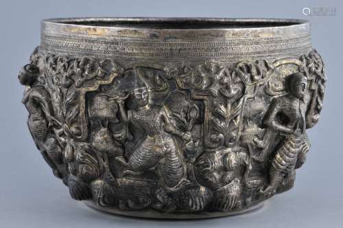 Silver bowl. Burma. 19th/early 20th century. Repousse work of dancers and floral motifs. Engraved mythical animal and inscription on the base. 10