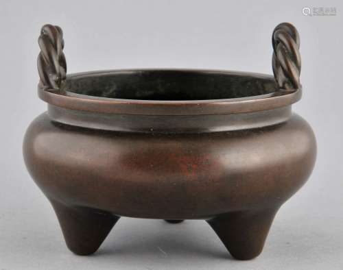 Bronze censer. China. 20th century. Reeded handles. Tripod base. Hsuan Te mark on the  base. 4