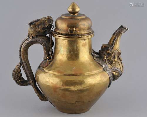 Teapot. Tibet. 19th century. Brass body with silver mounts. Dragon handle and spout. 11-1/2