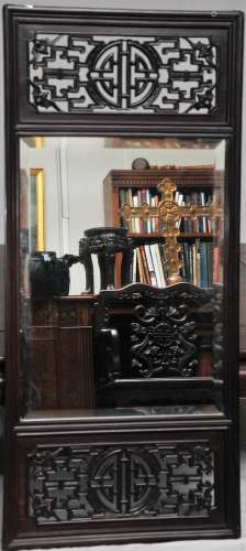 Mirror. China. Early 20th century. Rosewood frame carved and pierced with bats and shou characters. 36-1/2