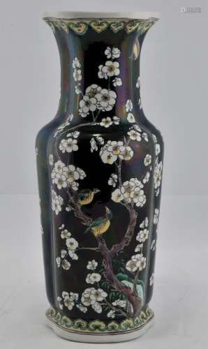 Porcelain vase. China. Early 20th century. Ju-I shaped trefoil form. Famille Noir decoration of birds in a flowering tree, green and yellow ju-I borders. 12-1/2
