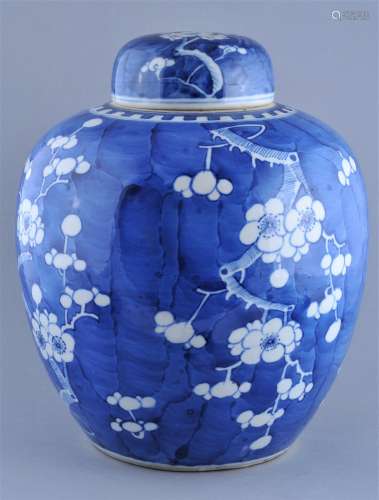 Porcelain covered jar. China. 19th century. Underglaze blue decoration of flowering prunus on a cracked ice ground. 13