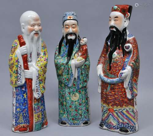 Set of The Three Gods of Luck. China. 20th century. Decoration of Famille Rose enamels. Tallest 17-1/2