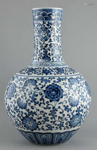 Porcelain vase. China. 20th century. Bottle form. Underglaze blue decoration of lotus scrolls. Ch'ien Lung mark. 13-1/2