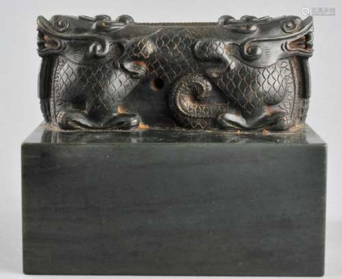 Large Jade seal. China. 20th century. Dark green jade with a double dragon finial. 5-1/2