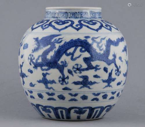 Porcelain vase. China. 19th century. Globular form. Underglaze blue decoration of dragons, pearls and clouds. Thunder meander and ju-i borders. 5-1/2