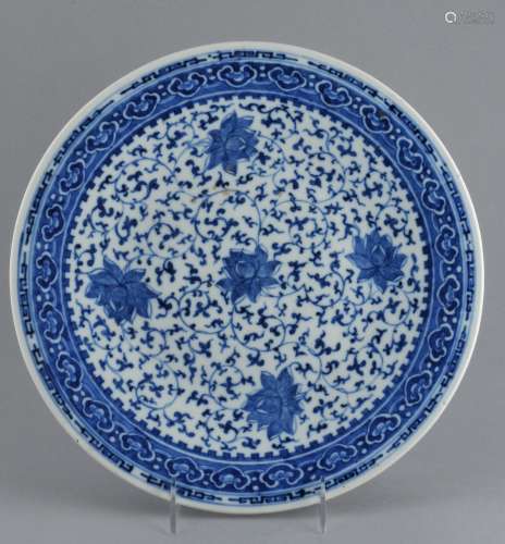Porcelain plate. China. 19th century. Underglaze blue decoration of lotus scrolls with Ju-i borders. Four character Ch'ien Lung mark on the base. 12