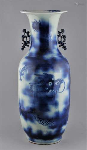 Porcelain vase. China. Early 20th century. Floral handles. Underglaze blue decoration of a dragon and clouds. 22-1/2