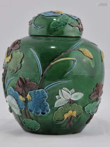 Porcelain covered jar. China. Early 20th century. Fa Hua work, relief  decoration of lotus and egrets in san tsai colours. Green ground. 8