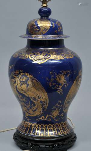 Porcelain covered jar. China. 19th century. Blue monochrome with gilt decoration of phoenix's. Drilled and mounted as lamp. Jar 18