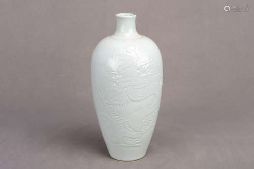 WHITE GLAZE AND CARVED 'DRAGON' VASE