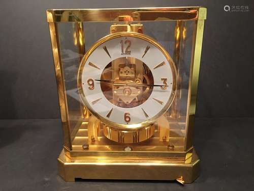 A large fine Brass Air powered Clock, 9