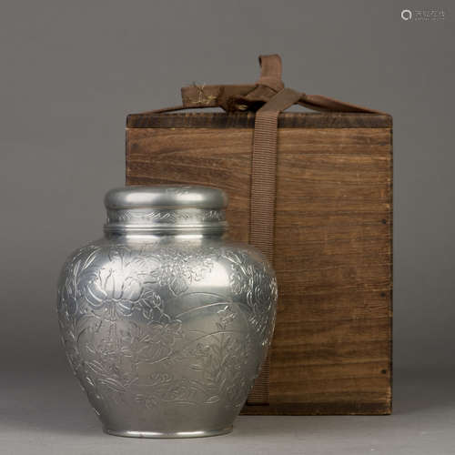 A SILVER CONTAINER FOR TEA