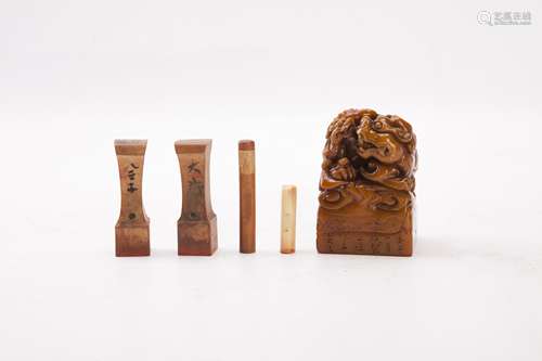 Group of Five Wooden and Soapstone Seals