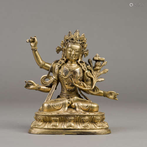 A GILT BRONZE SCULPTURE OF FOUR-ARMED MAITREYA