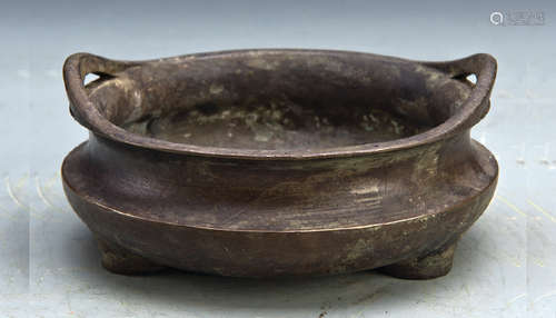 A THREE-FOOTED BRONZE CENSER