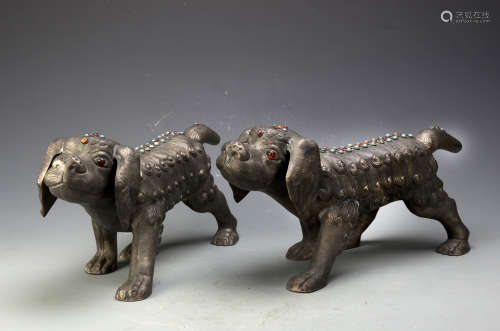 A PAIR OF BRONZE DOGS