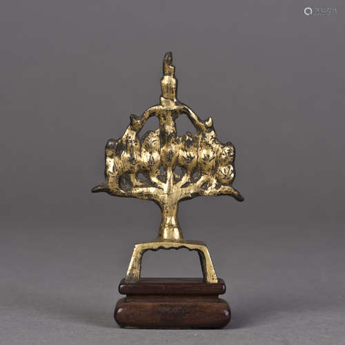 A GILT BUDDIST ORNAMENT