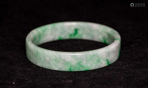 A TRANSLUCENT NATURAL GREEN JADE BANGLE WITH GIA CERTIFICATE