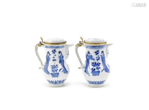 A pair of blue and white 'Long Elizas' metal-mounted jugs and covers,Kangxi