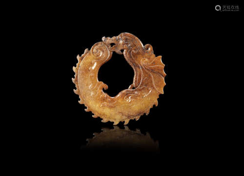 A russet jade 'dragon' ring, bi