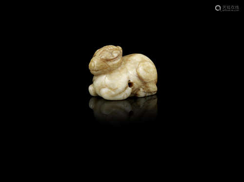 A mottled cream jade carving of a recumbent mythical beast,Yuan/Ming Dynasty