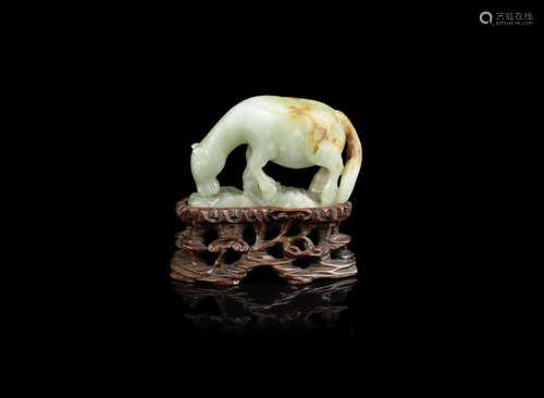 A green and russet jade carving of a horse,19th century