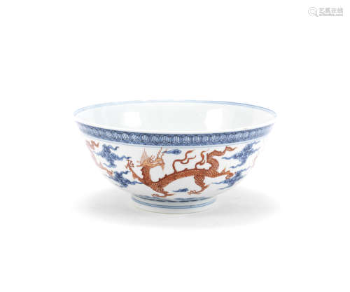 A rare iron red and underglaze blue Ming-style 'dragon' bowl,Kangxi six-character mark and of the period