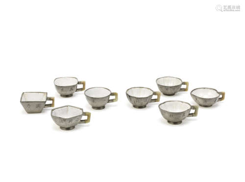A set of eight pewter-encased Yixing tea cups,Early 19th century