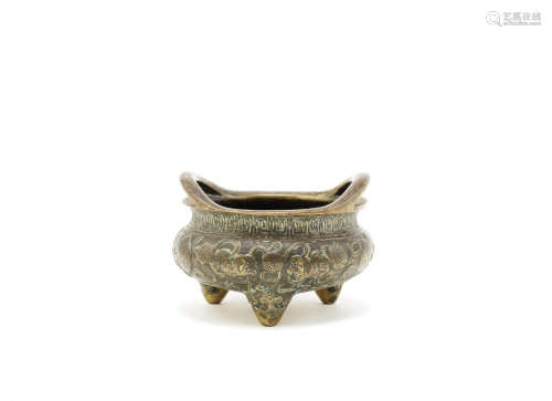 A bronze 'Buddhist lion' tripod incense burner,Xuande four-character mark, 17th/18th century