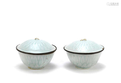 A rare pair of qingbai 'lotus' bowls and covers,Song/Yuan Dynasty