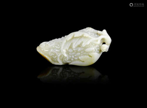 A large pale green and russet jade bitter melon carving