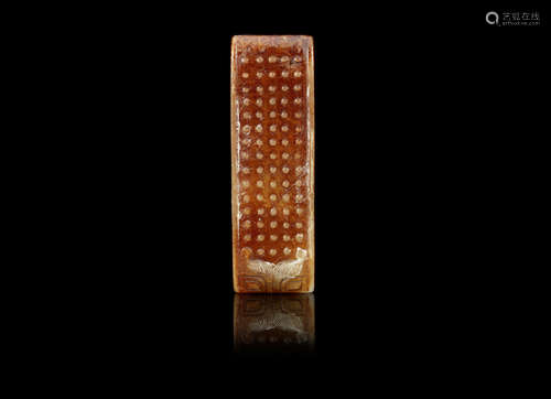 A white and stained russet jade Han-style scabbard slide,Probably Qing Dynasty