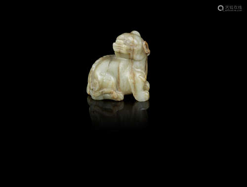 A pale green and russet jade carving of a luduan,Ming Dynasty