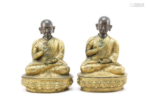 A pair of parcel-gilt bronze repoussé figures of luohans,18th century