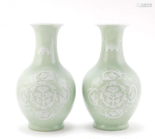 A pair of slip-decorated celadon-ground bottle vases,20th century