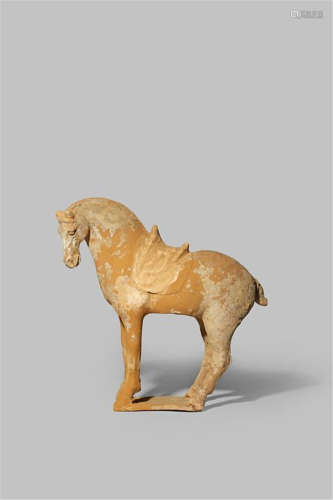 A CHINESE POTTERY MODEL OF A HORSE TANG DYNASTY 618-907 AD