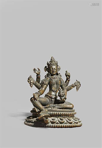 A NEPALESE GILT BRONZE SEATED FIGURE OF VASUDHARA 10TH/11TH CENTURY