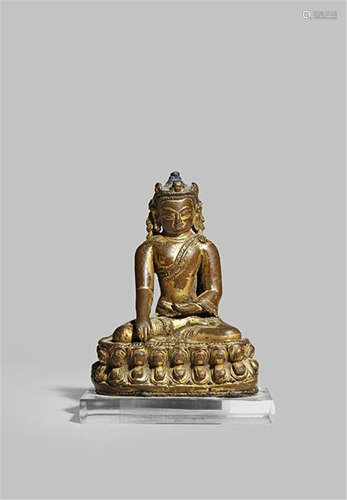 A SMALL TIBETO-CHINESE GILT BRONZE FIGURE OF BUDDHA 14/15TH CENTURY