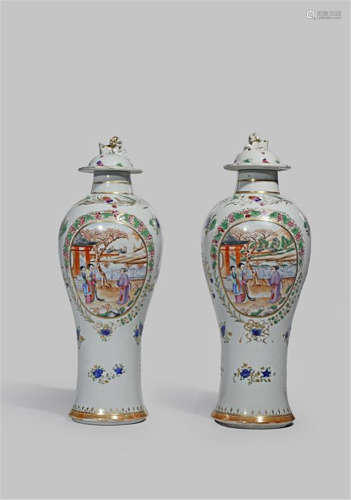 A PAIR OF CHINESE FAMILLE ROSE SLENDER BALUSTER VASES AND COVERS C.1800